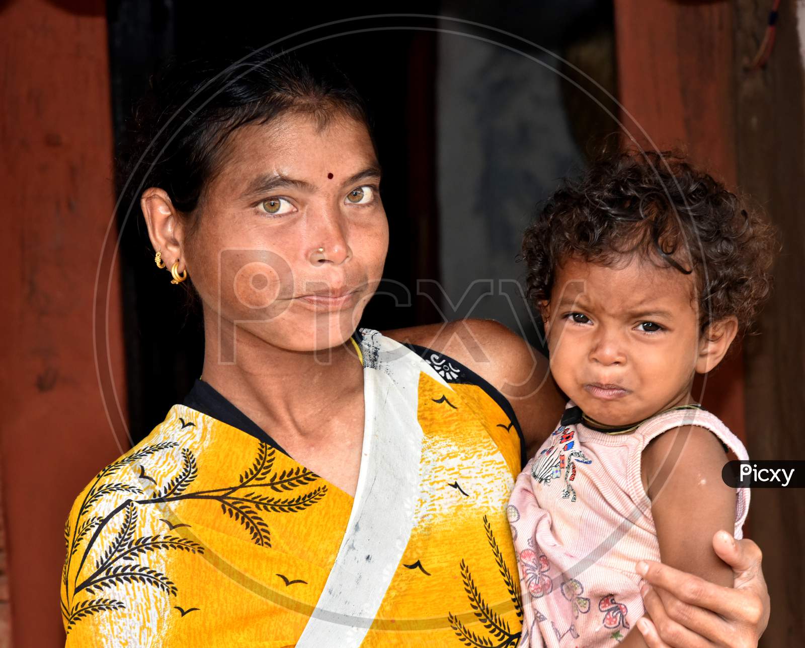 Portrait Of Indian Mother With Her Child in an Rural Village