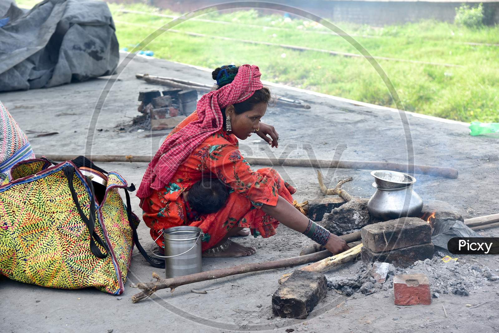 Migratory Poor Family Woman Making Food