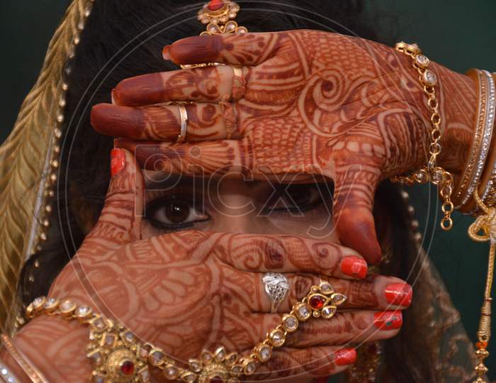 Indian Bride With mehandi Hands And Jewelery