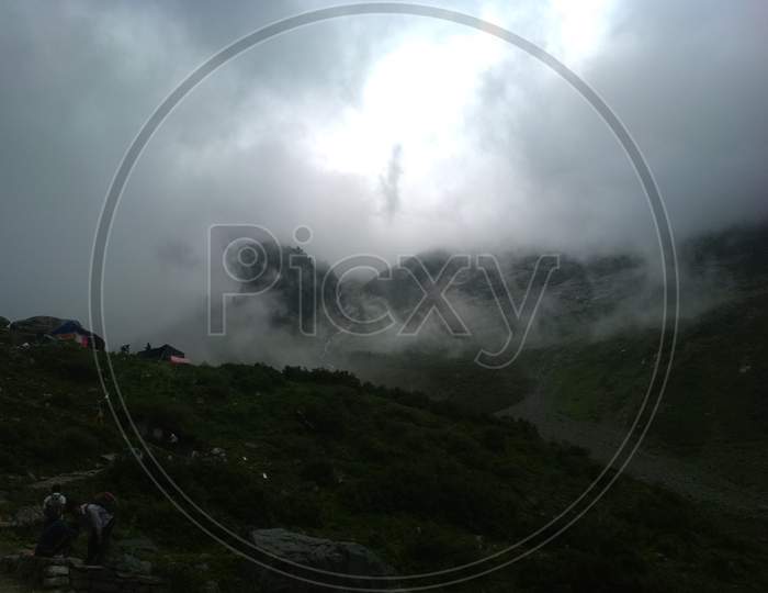 Landscape Of Himachal Pradesh With Fog Clouds over Green Terrains