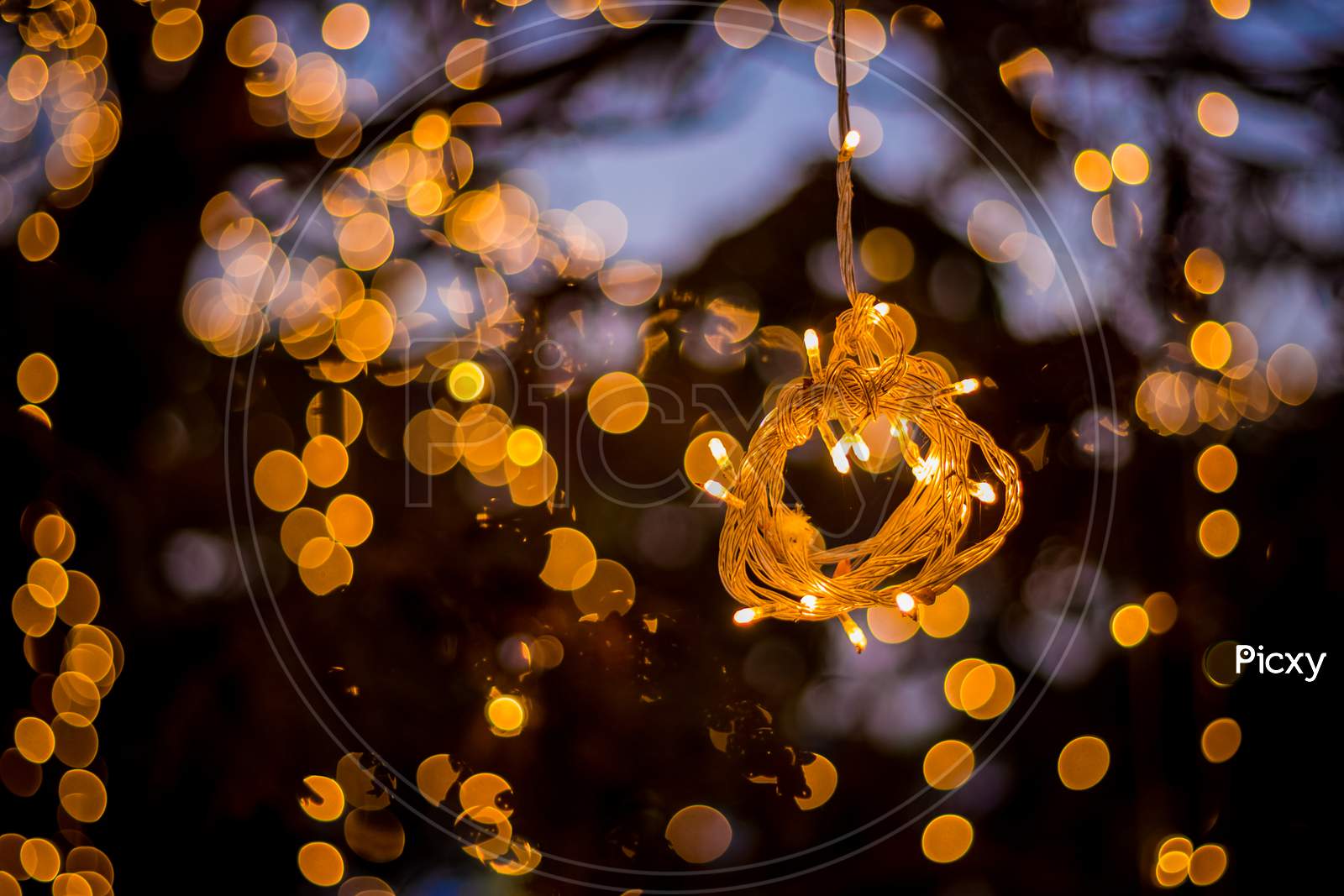 Bokeh Tree Light Decoration - Welcoming House And The Fabulous Party And Christmas Night - Outdoor Trees Have Been Decorated With Yellow Lights images