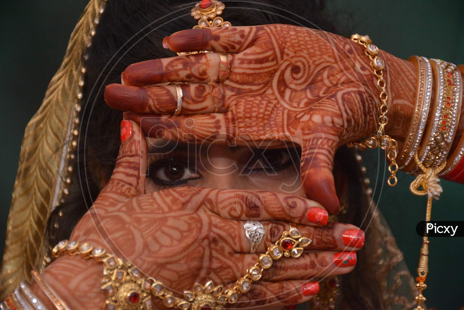 Indian Bride With mehandi Hands And Jewelery