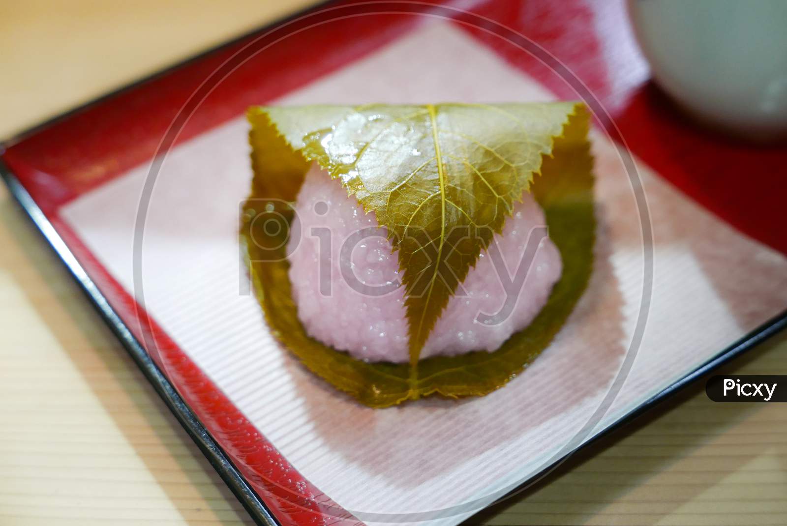 Sakura mochi wrap with sakura leaf pickle, a delicacy sweet treat in Japan during sakura blossom season