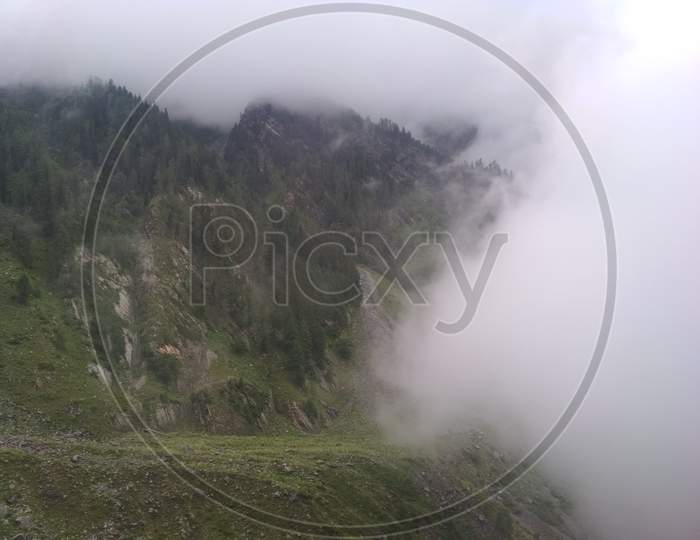 Landscape Of Himachal Pradesh With Fog Clouds over Green Terrains