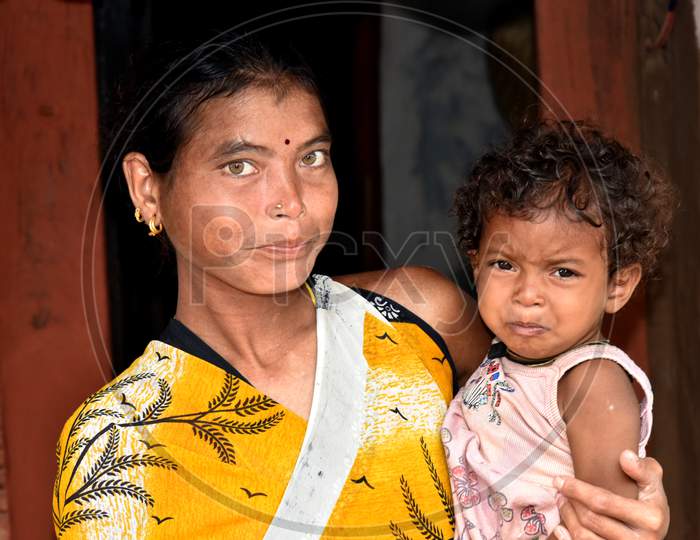 Portrait Of Indian Mother With Her Child in an Rural Village