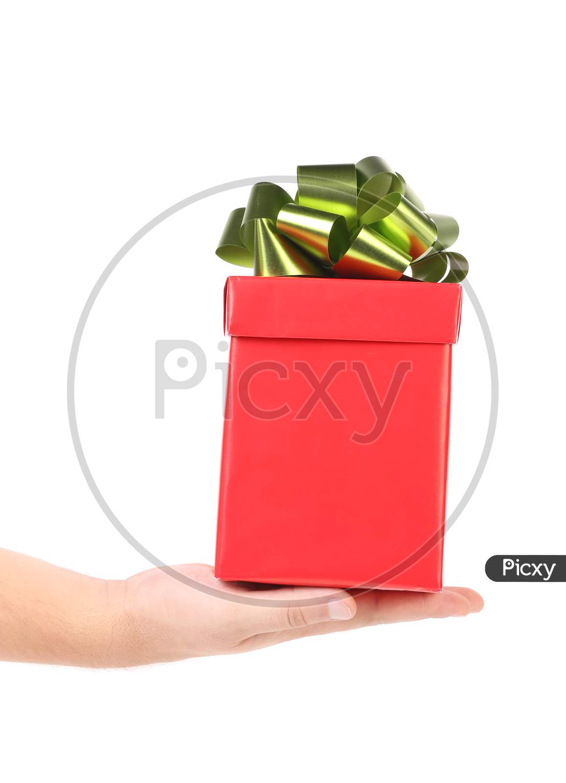 Hand Holds Red Box With Bow. Isolated On A White Background.