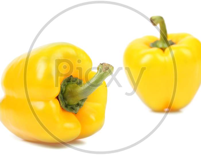 Close Up Of Yellow Peppers. Isolated On A White Background.