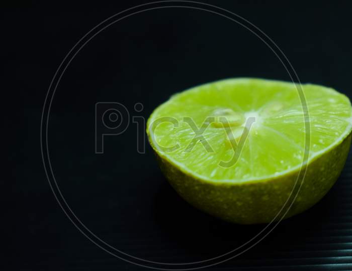 slice of lemon with black background