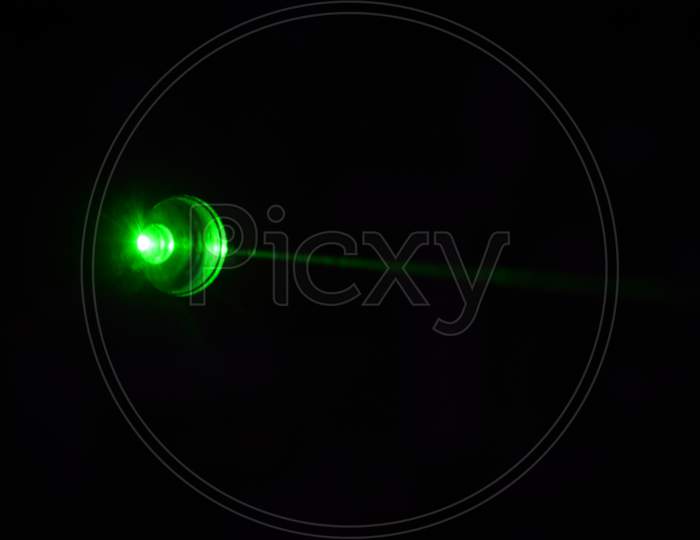 disco green light on black background