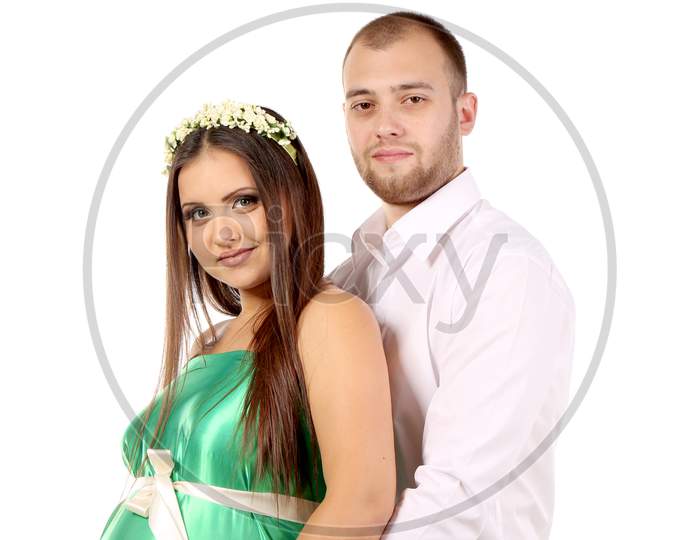 Happy Couple Expecting Baby. Isolated On A White Background.