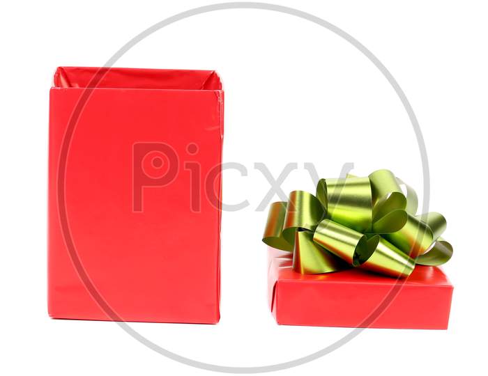 Opened Red Box With Green Bow. Isolated On A White Background.
