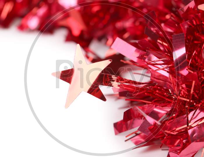 Close Up Of Christmas Red Tinsel. Whole Background. Place For Text.