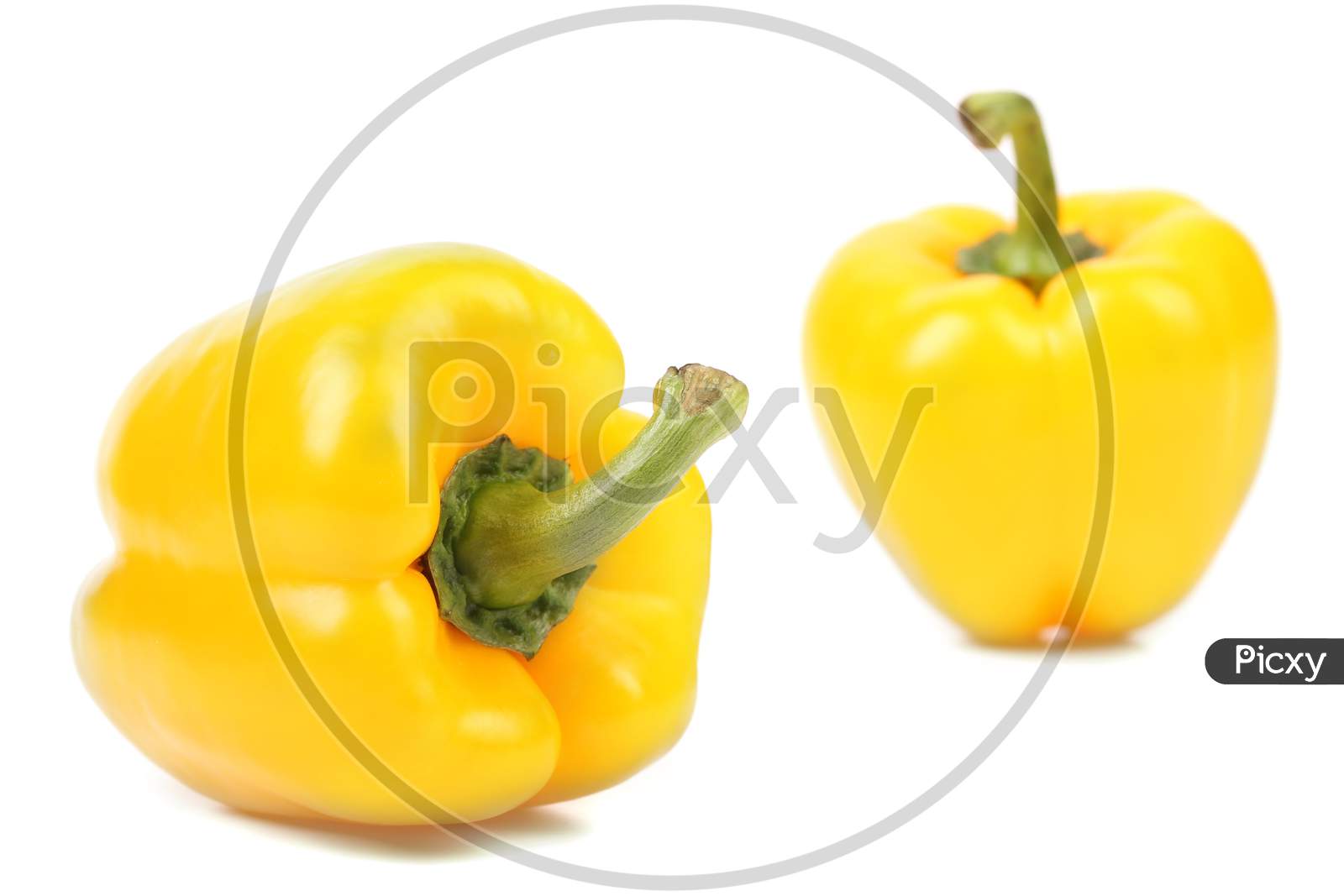 Close Up Of Yellow Peppers. Isolated On A White Background.