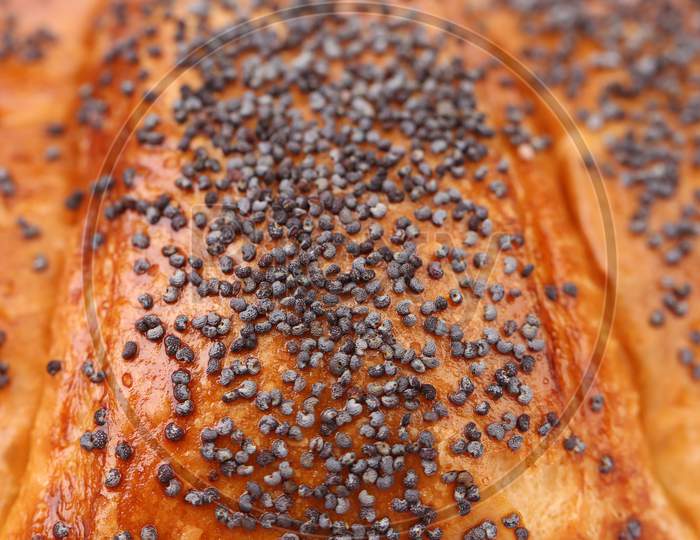 Close Up Of Appetizing Croissants With Poppy. Whole Background.