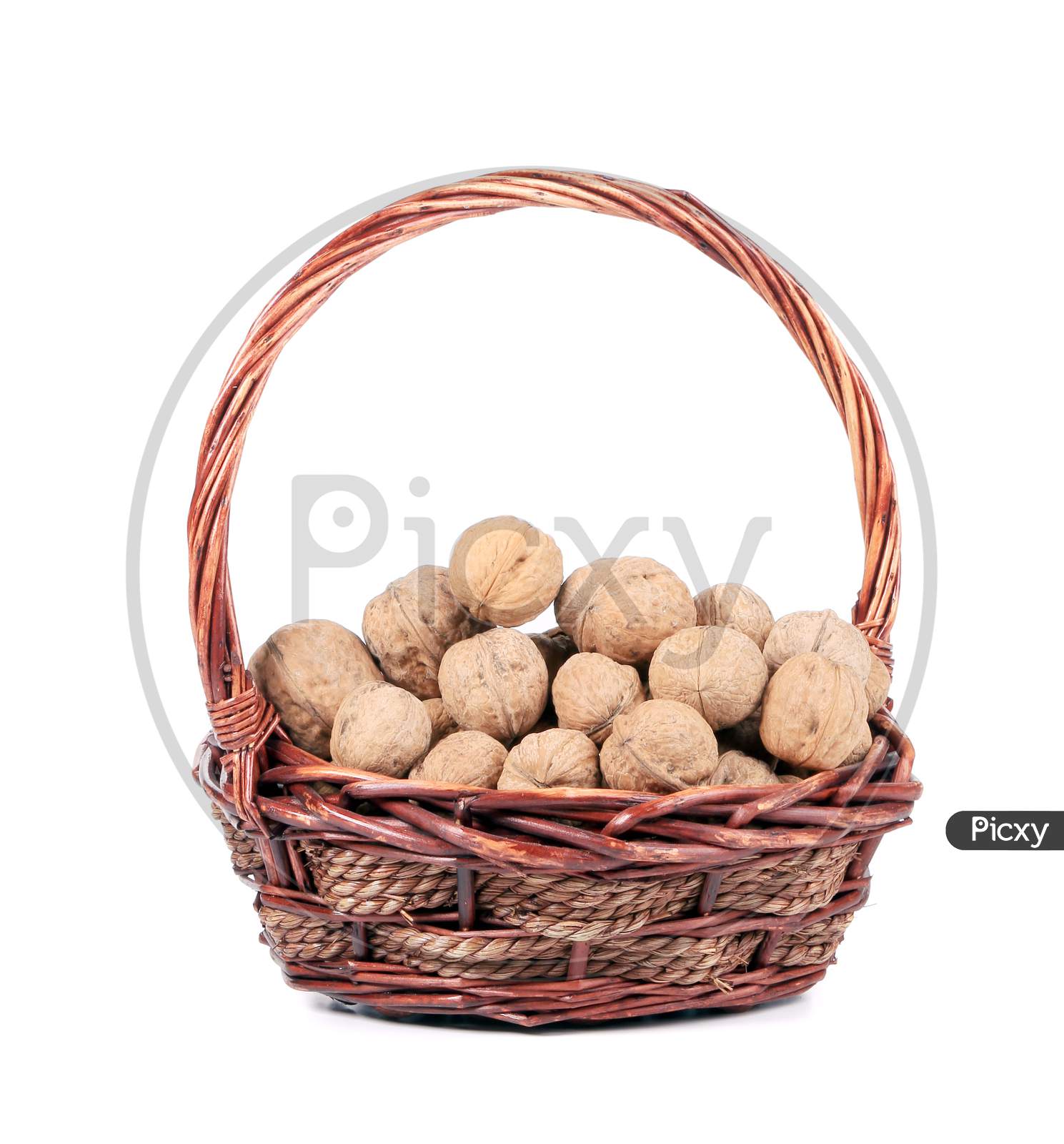 Basket With Walnuts. Isolated On A White Background.