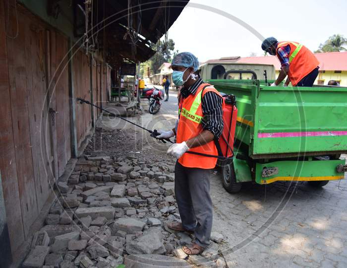 A Municipality Worker Spray Disinfectant During India Government-Imposed Lockdown As A Preventive Measure Against The Covid-19 Coronavirus In Nagaon District Of Assam,India
