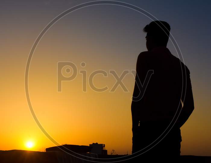 silhouette of a man in sunset