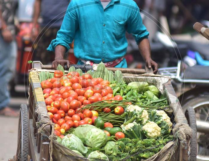 A Vendor Carry Vegetables  On His Cart From A Wholesale Market For Sale During The Nationwide Lockdown Imposed In The Wake Of Coronavirus Pandemic, In Nagaon District Of Assam On March 27,2020.