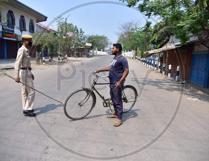 Police Personnel Question Commuters Who Defied Curfew During A 21-Day Nationwide Lockdown, In The Wake Of Coronavirus Pandemic, In Nagaon District Of Assam,India