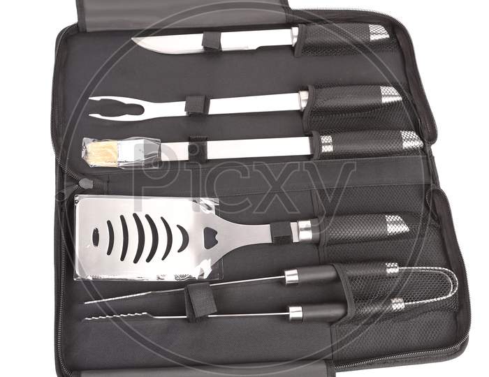 Set Of Tools For Bbq In Black Bag. Isolated On A White Background.