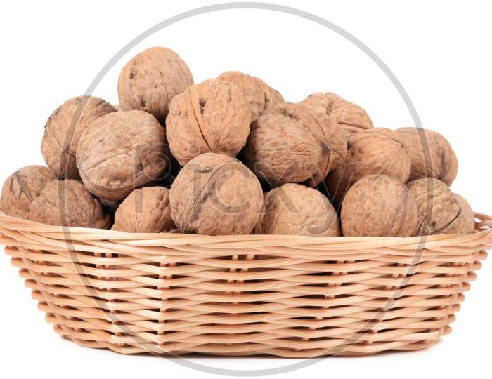 Basket Of Walnuts. Isolated On A White Background.