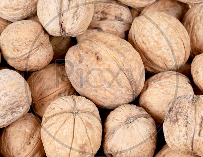 Bunch Of Walnuts Whole. Close Up. Whole Background.