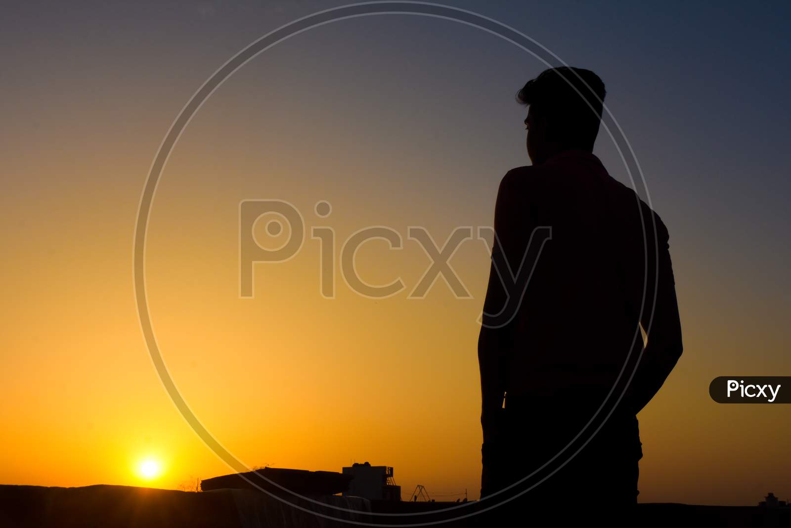 silhouette of a man in sunset