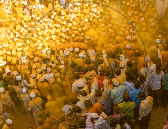 People Throwing Turmeric At Jejuri Temple  - Yellow Festival.