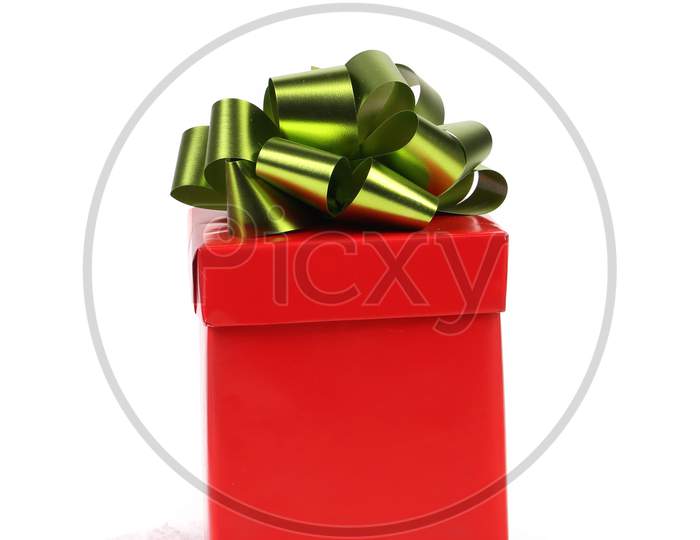 Red Gift Box With Green-Golden Bow. White Background.