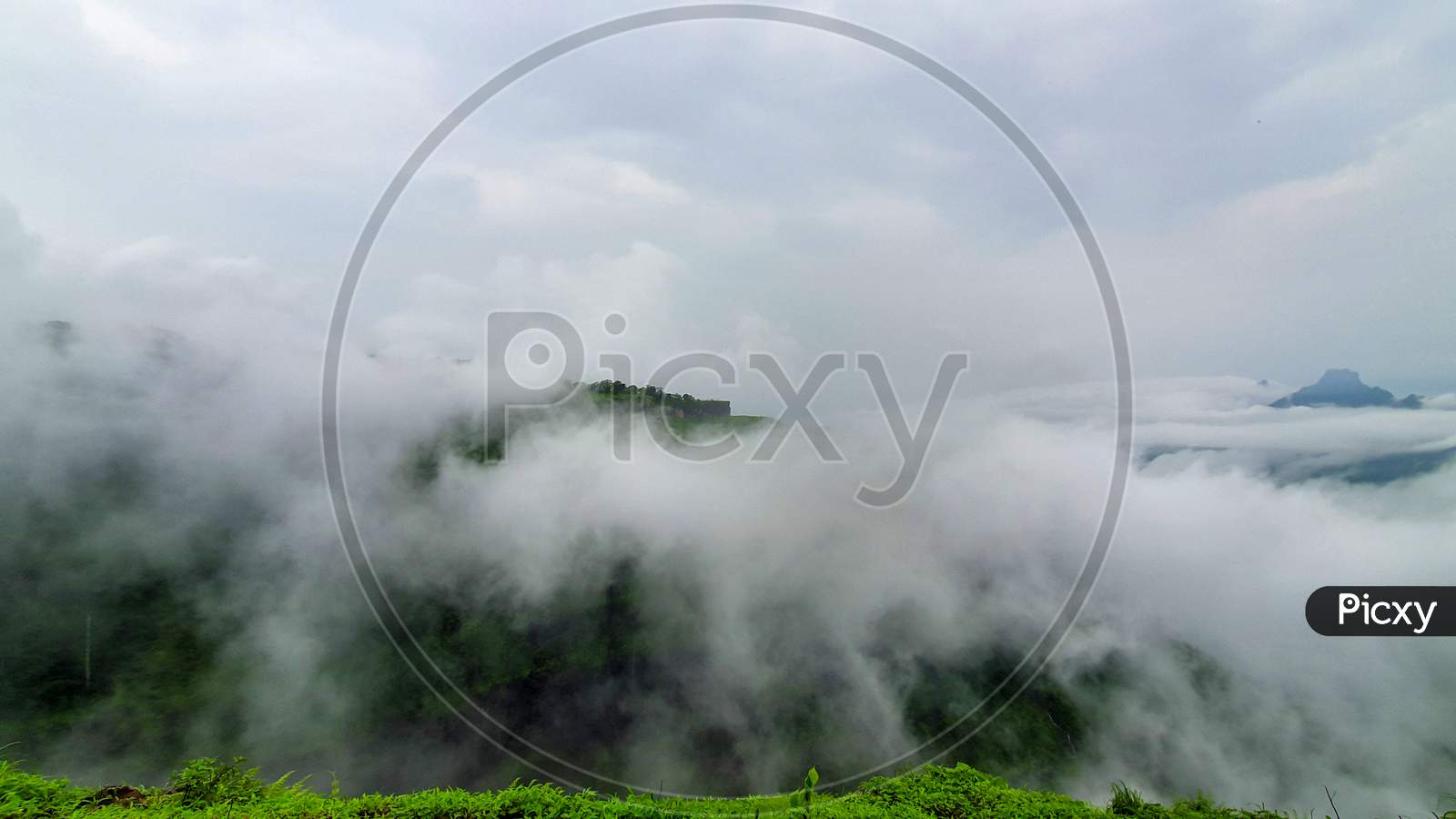 Malshej Ghat Landscape Shot With Clouds Covering Hill Top