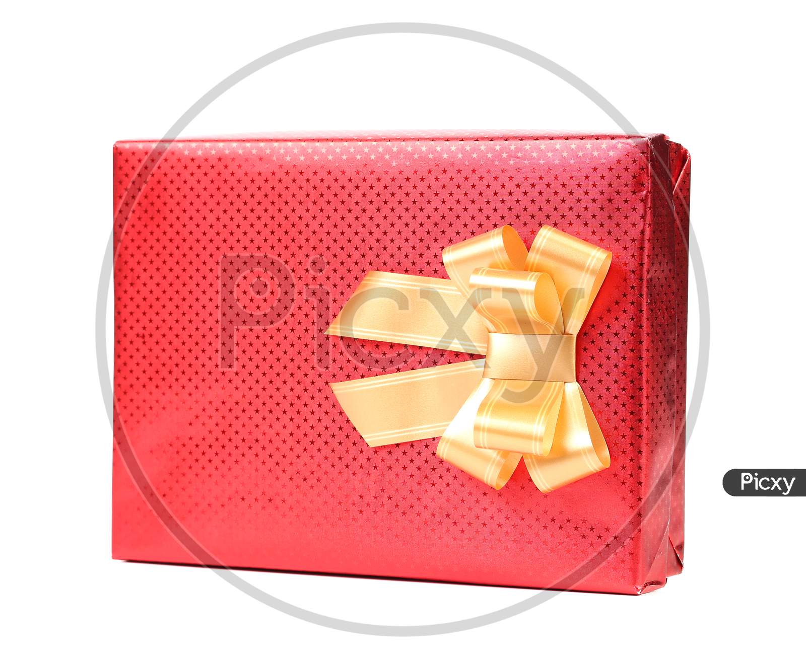 Red Gift Box With Golden Bow. Isolated On A White Background.