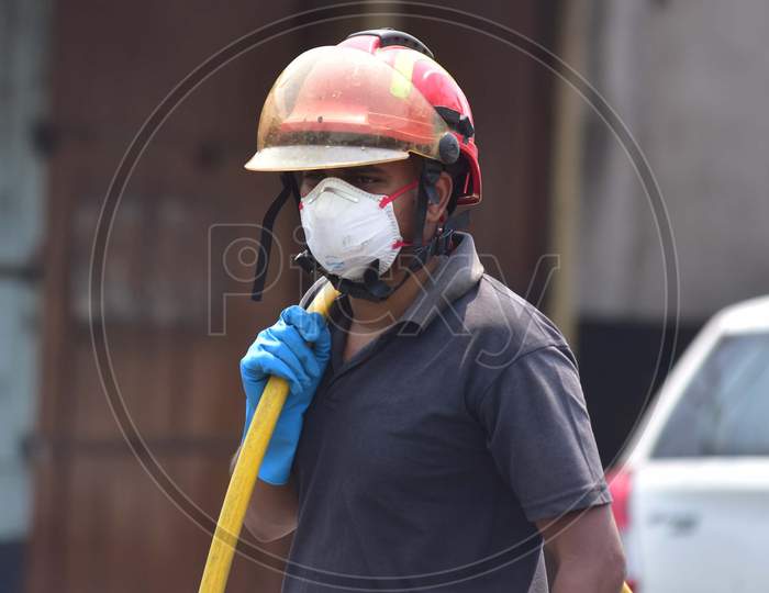 Firefighter Wear Masks As A Preventive Measure Against Coronavirus    In Nagaon District Of Assam ,India