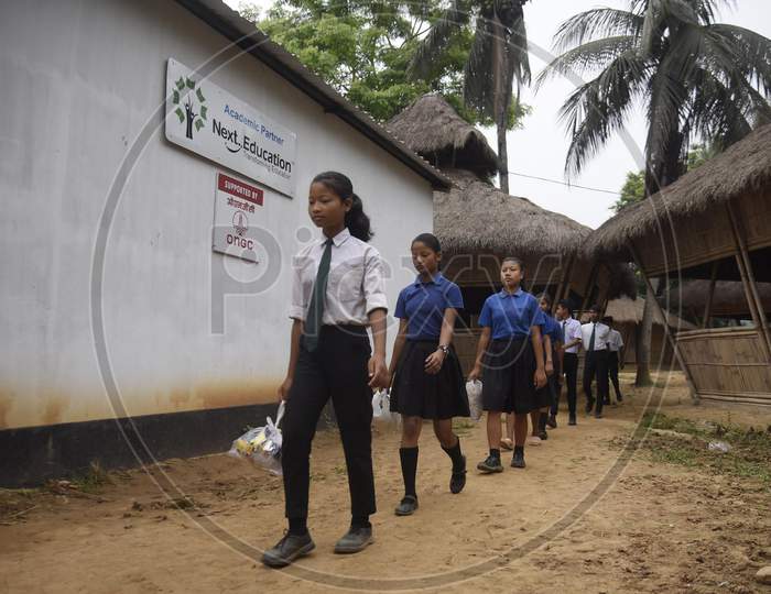 students gather plastic bags before giving them as fees at the Akshar Forum school in Pamohi on the outskirts of Guwahati