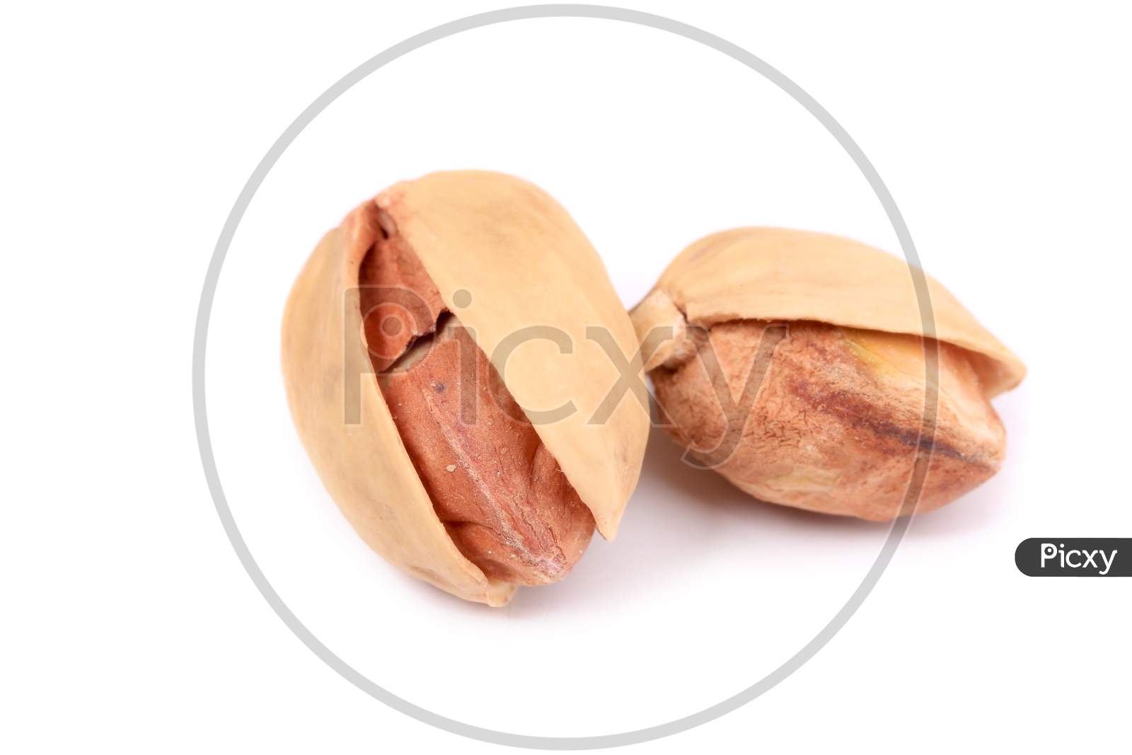 Two Pistachios Close-Up. Isolated On A White Background.