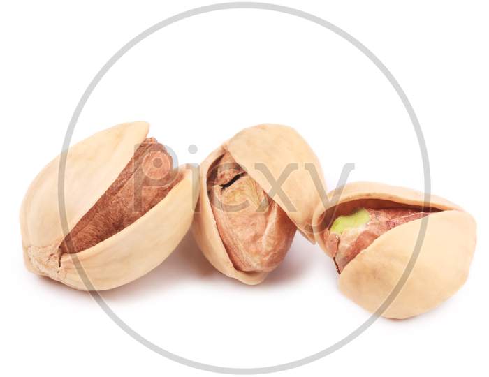 Three Pistachios Close Up. Isolated On A White Background.