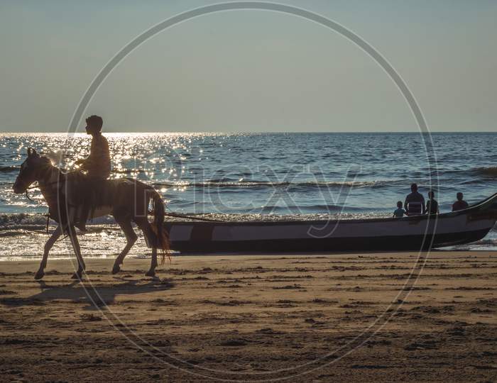 Family Members Spending Their Peaceful Time On Morning Sunrise Seascape And Horse Riding . Family Siting On Boat