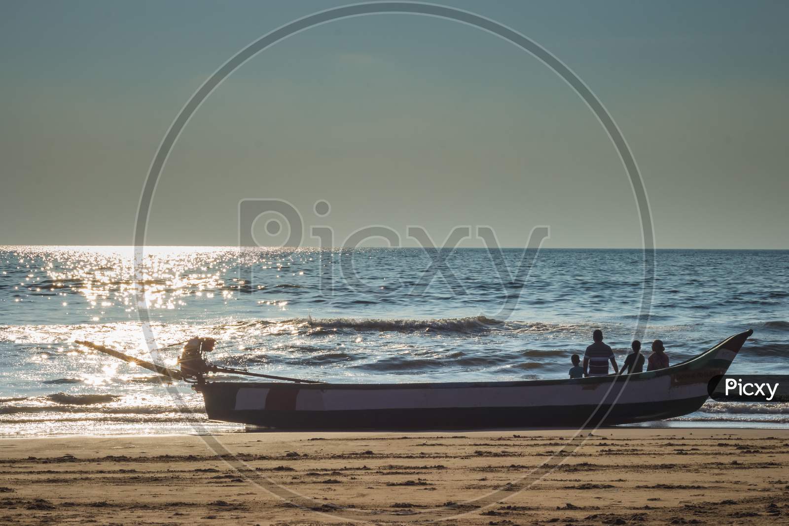 Family Members Spending Their Peaceful Time On Morning Sunrise Seascape. Family Siting On Boat