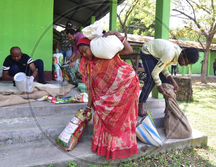 Nagaon Needy People Carry Ration After Recived From Goverment Volunteers During A Nationwide Lockdown, Imposed In The Wake Of Coronavirus COVID-19 Pandemic In Nagaon District Of Assam On April 04,2020.