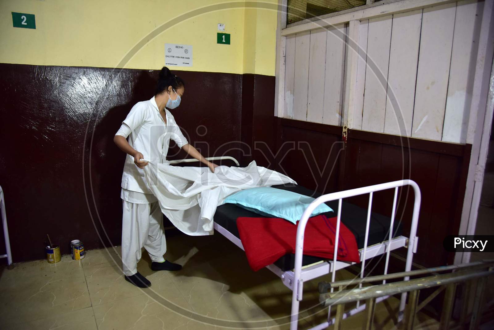 A Nurse  Arranges Beds  Of A Isolation Ward  At Civil Hospital  During A Government-Imposed Nationwide Lockdown As A Preventive Measure Against The Covid-19 Coronavirus In Nagaon District Of Assam On March 30,2020