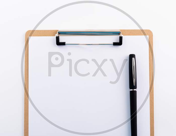 Blank Paper On Wooden Clipboard With Pen On Space On Background, Copy Space