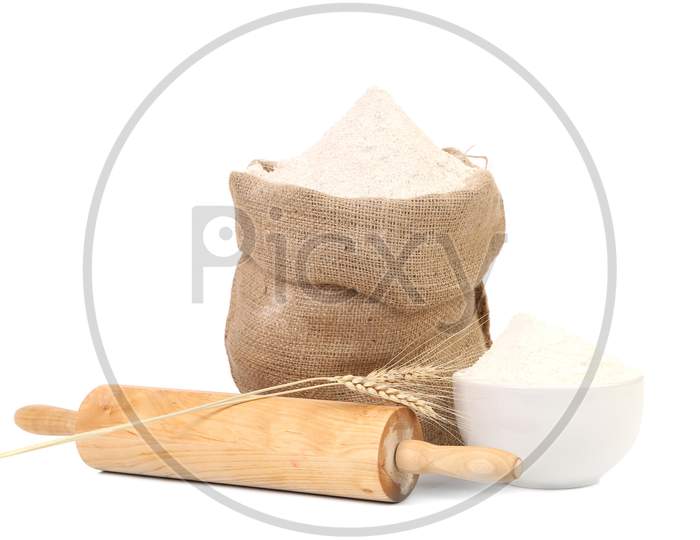 White Flour And Rolling Pin. Isolated On A White Background.