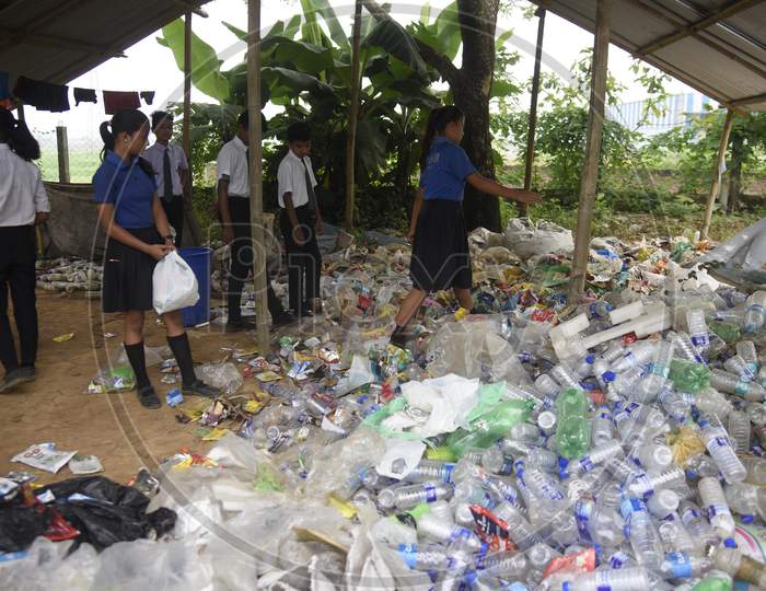 students gather plastic bags before giving them as fees at the Akshar Forum school in Pamohi on the outskirts of Guwahati
