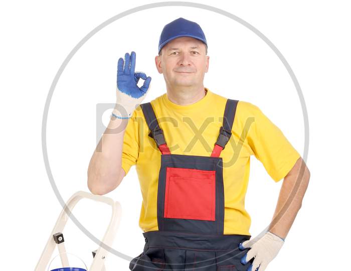 Worker On Ladder Showing Sign Okey. Isolated On A White Background.