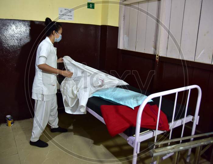 A Nurse  Arranges Beds  Of A Isolation Ward  At Civil Hospital  During A Government-Imposed Nationwide Lockdown As A Preventive Measure Against The Covid-19 Coronavirus In Nagaon District Of Assam On March 30,2020.