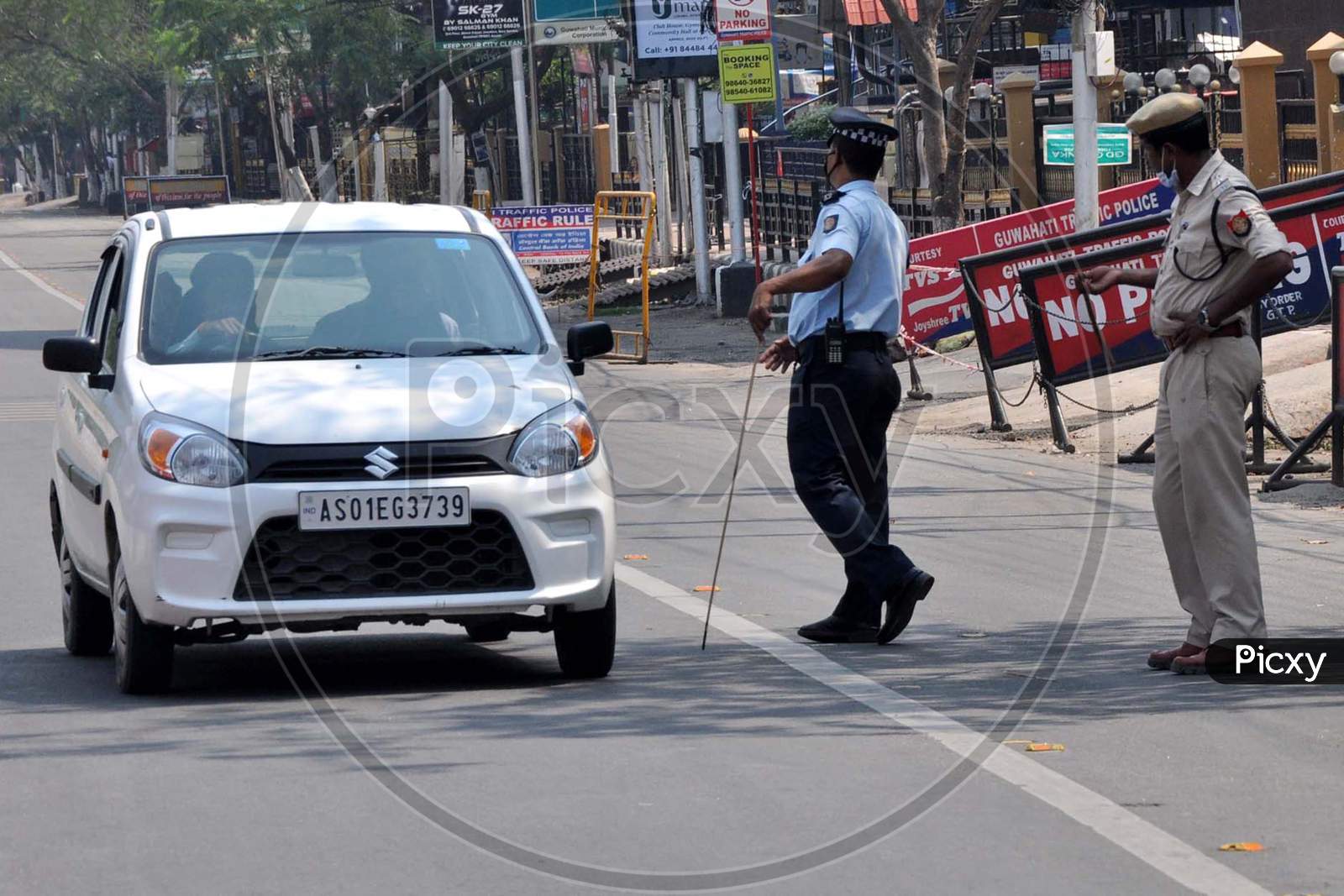 Police Personnel Question Commuters Who Defied Curfew During A 21-Day Nationwide Lockdown, In The Wake Of Coronavirus Pandemic, In Guwahati  On  Wednesday, March 25, 2020.