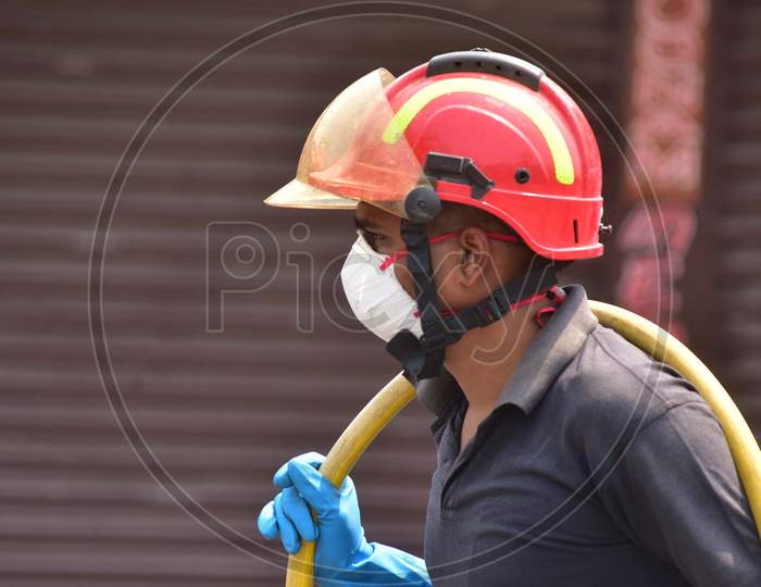 Firefighter Wear Masks As A Preventive Measure Against Coronavirus    In Nagaon District Of Assam ,India