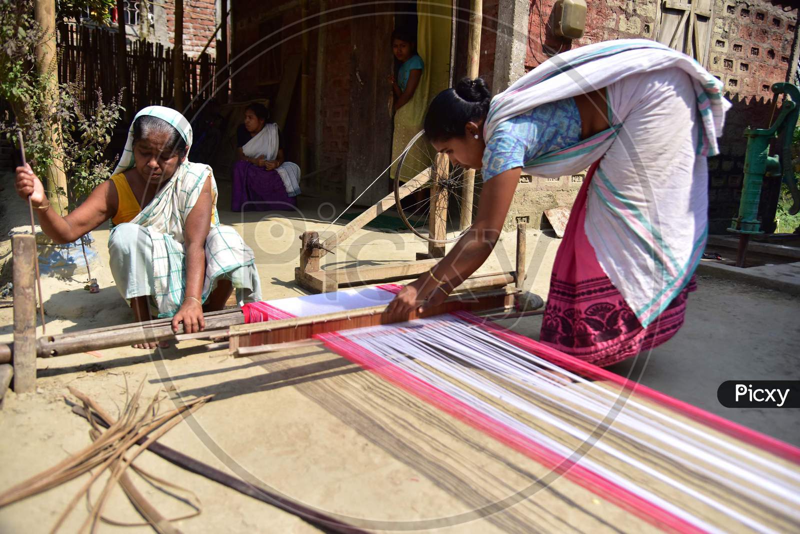 Women Busy In Weaving Traditional Assamese Gamosa Ahead Of Rongali Bihu Festival  During The Nationwide Lockdown Imposed In Wake Of Coronavirus Pandemic, In Nagaon District Of Assam On April 02,2020