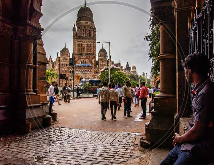 A Pedestrian Looking At Greater Bombay Municipal Corporation (BMC) Building