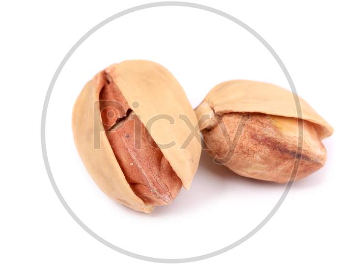 Two Pistachios Close-Up. Isolated On A White Background.