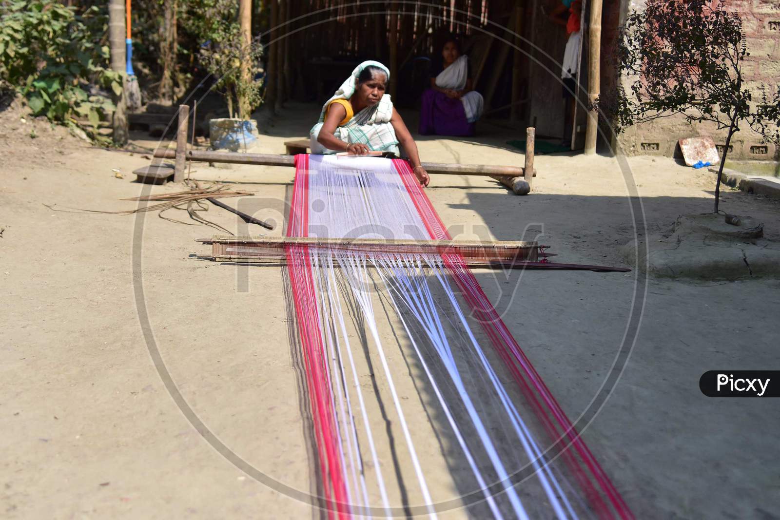 Women Busy In Weaving Traditional Assamese Gamosa Ahead Of Rongali Bihu Festival  During The Nationwide Lockdown Imposed In Wake Of Coronavirus Pandemic, In Nagaon District Of Assam On April 02,2020